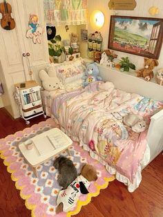 a bedroom with teddy bears and other stuffed animals on the floor next to a bed