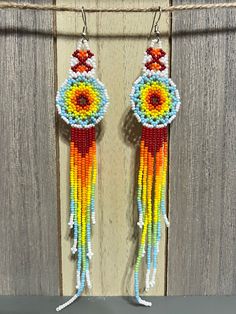 "Thank you to stopping by my shop You will love these large tassel earrings These earrings are super cute!  They're light but an awesome statement piece. Great for a Christmas Gift, mother's day, Birthday gift, gifts for her or any day of the year! 1\" x 6.5\"long" Bohemian Rainbow Beaded Earrings With Fringe, Festival Beaded Earrings With Fringe, Unique Fringed Beaded Earrings For Festivals, Unique Fringe Beaded Earrings For Festivals, Bohemian Rainbow Beaded Earrings For Summer, Bohemian Rainbow Beaded Earrings For Beach, Handmade Tassel Earrings For Festivals, Handmade Unique Tassel Earrings For Festivals, Adjustable Dangle Beaded Earrings Hippie Style