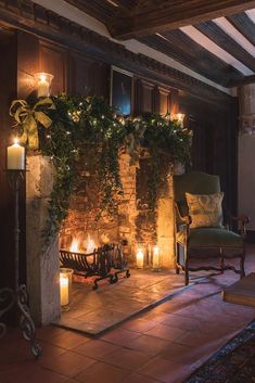 a fireplace with candles lit in front of it