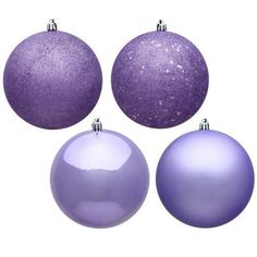 three purple christmas ornaments are shown in the shape of baubles, one with glitter on it