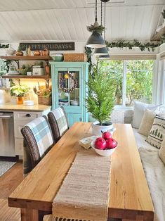 a wooden table sitting inside of a kitchen