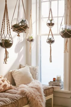 an image of hanging macrame terrariums in the bedroom