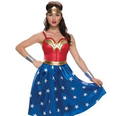 a woman in a wonder costume standing with her hands on her hips