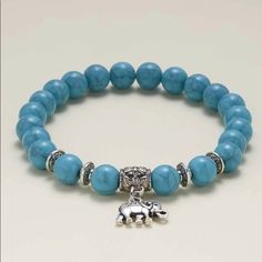 Turquoise Stone Is The One That Align And Balance The Chakra It’s Known To Dispel Negative Energy This Bracelet Has A Elephant Charm For Good Luck Its Made With Elastic Clear String To Stretch Perfect For A Gift To Someone Special Bohemian Light Blue Bracelets For Jewelry Making, Casual Turquoise Beaded Jewelry, Elegant Turquoise Adjustable Charm Bracelet, Casual Turquoise Jewelry With Natural Stones, Casual Turquoise Bracelet Jewelry, Casual Light Blue Round Bead Jewelry, Casual Turquoise Bracelet, Casual Light Blue Round Beaded Jewelry, Casual Turquoise Bracelets For Jewelry Making