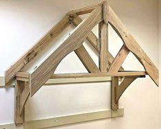 a wooden structure is hanging on the wall