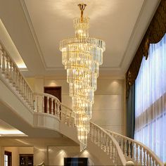 a large chandelier hanging from the ceiling in a living room