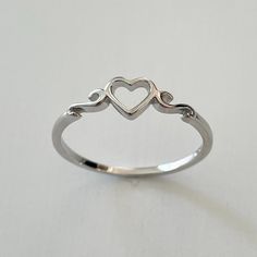 Sterling Silver Cute Tiny Heart Ring, Dainty, Silver, Statement, Love, I Love You, Thank You Ring. Can Be Wear On Multiple Fingers And Midi Ring Or Toe Ring. Symbolizes Love, Unity, Trust, And Friendship 925 Stamped Perfect Gift Idea For Birthday, Anniversaries, Engagement, Graduations, Bridesmaid, Mother’s Day, Valentine’s Day, Christmas, Promise, Good For Any Occasion. Note: Due To The Difference Between Different Phone Or Monitors, The Pictures May Not Reflect The Actual Color Of The Ring. We Hesrt Rings, Jewellery Rings Silver, Cool Promise Rings, Cute Ring Designs, Cute Aesthetic Rings, Pretty Silver Rings, Silver Rings Jewelry, Silver Anniversary Ring, Promise Rings For Her Silver