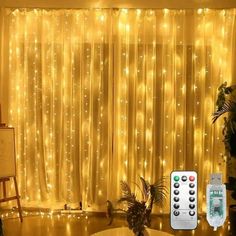 a living room filled with lots of lights next to a large window covered in curtains