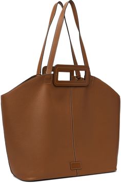 Grained leather tote in tan. · Twin carry handles and shoulder straps · Logo patch at face · Lobster clasp at interior · Detachable zip pouch at interior · Suede lining · Contrast stitching in white · H13 x W22.5 x D6 Supplier color: Tan Modern Staud Rectangular Bag, Modern Rectangular Staud Bags, Modern Rectangular Staud Bag, Brown Calf Leather Shoulder Bag With Handles, Staud Luxury Leather Shoulder Bag, Brown Calf Leather Bag With Handles, Staud Bags With Top Carry Handle For Everyday, Brown Calf Leather Satchel With Double Handle, Modern Staud Bag With Top Carry Handle