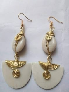 The earrings are made from brass, cowries and bone with a lot of love and care. The are light in weight and comfortable to wear. Buy more than one pair of earrings and pay shipping for one. For more earrings, follow the link. https://www.etsy.com/listing/710219155/african-earringslong-beaded-earrings?ref=shop_home_active_2 **Happy shopping** Dhl shipping express Thank you. Afro Jewelry, Aluminum Wire Jewelry, African Earrings, Dope Jewelry, Women Earrings, African Jewelry, Jewelry Lookbook, Brass Earrings, African Women