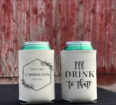 two can coolers sitting next to each other on top of a black tablecloth