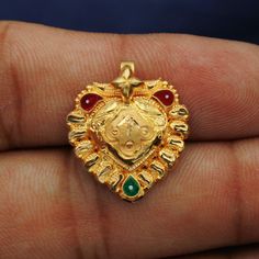 22 karat yellow gold handmade excellent tribal vintage design handmade pendant amulet jewelry wedding jewelry from rajasthan india. Gold Purity- 22k yellow Gold Length - 2.1 cm Width - 1.9 cm Weight - 1.45 grams approx 22k Gold Pendant Jewelry For Diwali, Dual-tone 22k Gold Jewelry Gift, 22k Gold Pendant Jewelry For Festivals, Dual-tone Yellow Gold Jewelry For Diwali, Yellow Gold Round Pendant Jewelry For Diwali, Gold Meenakari Round Pendant Jewelry, Yellow Gold Filigree Jewelry For Puja, Diwali Dual-tone Yellow Gold Jewelry, 22k Gold Temple Jewelry Round Pendant