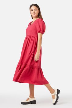 Berry red midi smock dress, with a sweet v neckline. Featuring a deep hem ruffle, short puff sleeves & made of a cotton viscose blend.- slip on this easy relaxed style smock- soft v neckline with a sweet puff sleeve- midi length featuring a hem tier with exposed ruffle- handy side pocket- elastic hem on sleeve- side ties to cinch in at waist- made of a smooth viscose cotton blend- available in cornflower Product Code: PGFY142 Midi Smock Dress, Red Midi, Cotton Viscose, Smock Dress, Relaxed Style, Side Pocket, V Neckline, Puff Sleeves, Midi Length