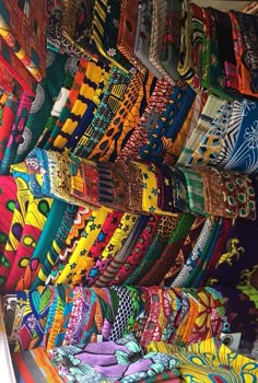 many colorful ties are on display in a store