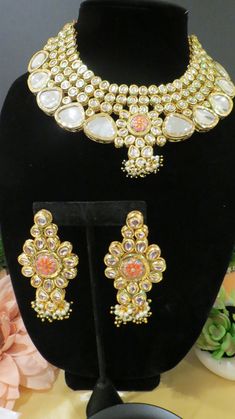 This beautiful choker is a modern twist to traditional jewelry and comes in a gold finish to match any outfit as desired. The choker is made of high quality stones and is a statement piece that can be dressed accordingly. The set comes with matching earrings and Tikka for a complete look. Designer Gold Jewelry With Meenakari, Designer Jeweled Jewelry Gift, Elegant Kundan Jeweled Choker, Elegant Chandbali Choker For Festivals, Elegant Meenakari Temple Choker Necklace, Elegant Kundan Choker Necklace For Festivals, Designer Gold Jeweled Jewelry, Designer Gold Necklace For Festive Occasions, Elegant Gold Choker With Stone Work