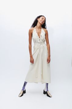 White wild silk halter dress, featuring a halter neck and open back. Self ties at neck and waist belt. Multiple ways of wrapping and wearing. Silk Halter Dress, Aviator Hat, Easy Tiger, Organic Fabrics, Mid Dresses, Fashion Line, Womens Size Chart, Easy Wear, Waist Belt