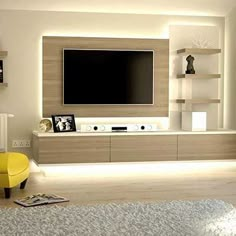 a modern living room with white walls and yellow furniture in front of the flat screen tv