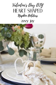 valentine's day diy heart shaped napkin holder on a table with flowers in the background