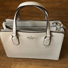 Beautiful (Nwt) Kate Spade Light Gray Leather Satchel Handbag! Two Handles & A Detachable Strap, Silver Hardware, Zipped Top Closure, Two Large Snapped Side Pockets, 3d “Kate Spade” On Front, Bottom Studs. Measures-12l X 8.5h X 5d Open To Reasonable Offers Only. Please Give Best Offer, Not Lowest Offer Bundle & Save $$ Thank You For Looking! No Trades Please. Packages Ship Daily Mon.-Fri., Sometimes On Saturdays. Please Be Patient As My Post Office Is Sometimes Slow Classic Silver Shoulder Bag With Detachable Strap, Classic Silver Top Handle Shoulder Bag, Classic Silver Satchel For Everyday Use, Classic Silver Shoulder Bag For Daily Use, Classic Silver Crossbody Bag, Elegant Silver Satchel With Detachable Handle, Classic Silver Rectangular Shoulder Bag, Silver Crossbody Satchel With Top Carry Handle, Classic Silver Crossbody Shoulder Bag