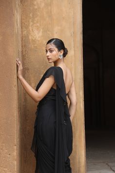 Featuring Black silk corset with mirror, thread embroidered paired with georgette drape saree with detailed and detachable belt. Fabric - Silk, Georgette Components - 3 Colour - Black Embroidery details - Machine Embroidery Delivery time - 2-3 weeks Washing Instructions - Dry-clean Black Drape Saree, Mirror Blouse, Silk Corset, Embroidery Mirror, Ruffle Saree, Drape Saree, Black Drapes, Black Embroidery, Types Of Work