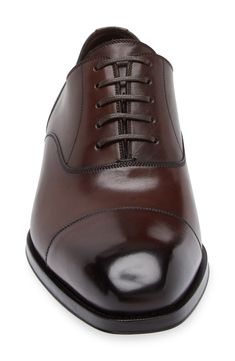 Styled with a cap toe and signature Blake welting, this burnished-leather oxford adds sophisticated flair to your formal looks. Lace-up style Leather upper, lining and sole Made in Italy Designer Shoes Oxford Shoes Brown, Brown Shoes Men, Patent Leather Oxfords, Summer Wardrobe Essentials, Men's Toms, Wedding Guest Shoes, Tom Ford Men, Leather Oxford Shoes, Sneaker Slippers