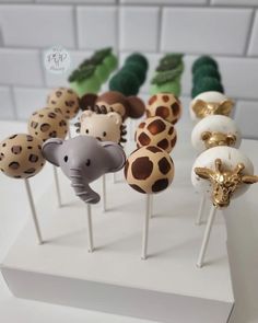 there are many cake pops with animals on them