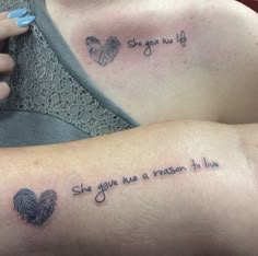 two people with tattoos on their arms that say she gave me a reason to live