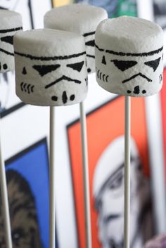 marshmallows decorated like darth vader's faces are on sticks