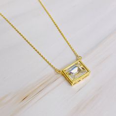 Elevate your everyday look with our Sweet Square Pendant Necklace. The sparkly pendant and dainty chain add a touch of chic elegance to any outfit. Wear it alone for a simple and sophisticated look, or layer it with other pieces for a stylish and versatile statement. Chain length: 16 inches with 2 inches extension 18k gold plated brass, glass jewel Lead and nickel free Made in China Lifetime Candles, Square Pendant Necklace, Cocktail And Mocktail, Water Blue, Hair Setting, Dainty Chain, Square Pendant, Diamond Pendant Necklace, Sympathy Gifts