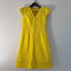 Elevate Your Wardrobe With This Stunning Calvin Klein Dress In Size 6. The Eye-Catching Yellow Color And Floral Pattern Make It A Perfect Choice For Any Occasion, Whether It's A Wedding, Party Or Casual Day Out. The V-Neckline And A-Line Style Are Flattering On Any Body Type, While The Short Sleeves And Knee-Length Make It Perfect For Summer, Fall, Or Spring. Crafted From 100% Cotton Knit Fabric With Embroidery Accents, This Dress Is Not Only Stylish But Also Wrinkle-Resistant, Ensuring That You Yellow Cotton V-neck Dress, Calvin Klein Summer Short Sleeve Dresses, Calvin Klein Summer Cotton Dress, Calvin Klein Cotton Spring Dresses, Spring Calvin Klein Cotton Dresses, Yellow Eyelet Dress, Black Sequin Shorts, Dinner Party Dress, Black Long Sleeve Sweater