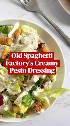 an old spaghetti factory's creamy pesto dressing is shown on a white plate