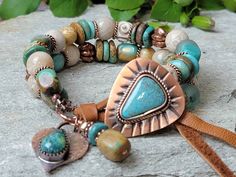 This Boho Turquoise bracelet features a stunning triangular Blue Mountain Turquoise Cabochon set in an Artisan Copper Button with patina. Two gorgeous, chunky strands of blue Hubei Turquoise discs and barrels, are mixed with creamy Fossil Coral rounds. I love the blend of these colors. It screams Summer! I added a few Aqua Glass beads from Java, African swirl Tribal beads and corrugated Copper beads. The dangles are an Artisan Copper Heart with an Arizona Turquoise teardrop. Caramel color Deersk Gemstone Projects, Southwestern Bracelets, Bohemian Jewels, Hubei Turquoise, Blessing Beads, Cloud Mountain, Blue Bamboo, Boho Turquoise, Southwestern Boho