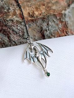 925 Sterling Silver Dragon Necklace,Hand Made Sterling Silver Dragon Necklace,Dragon Charm,Gothic Dargon Jewelry,Flying Dragon Necklace,Unisex Jewelry,Flying Dragon Necklace,Green Stone Necklace,Gift For Her,Gift For Him,Birthday gift,Christmas Gift,Valentines Gift, **DRAGON NECKLACE A silver dragon necklace is an exquisite piece of jewelry that has a mystical and powerful symbolism. In many cultures, dragons have meanings such as strength, wisdom, courage and protection. This necklace is designed with the intricate and detailed craftsmanship of the dragon, offering both aesthetic and spiritual value to the wearer. The silver material provides a look that is both durable and stylish. At the same time, silver is considered a precious metal, as well as an element that symbolizes health and e Necklace Green Stone, Necklace Dragon, Gift For Him Birthday, Silver Dragon Necklace, Green Stone Necklace, Flying Dragon, Dragon Necklace, Silver Dragon, Necklace Green