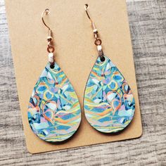 This pair of lightweight, teardrop earrings adds a unique touch, featuring original neuro-inspired artwork. They are artsy, vibrant and a creative way to advocate for healthy thought patterns. A unique accessory for anyone needing a gentle reminder, but also eye-catching jewelry for those in neuroscience, counseling or medical professions. If you are interested in the original artwork that inspired this item or seeing more from the art collection, visit Geinene.com or follow me on Instagram @Geinene .: Made from lightweight, MDF wood 1.6 inches .: Sturdy, chip-free coating keeps printed design vivid .: Image printed and transferred to both sides of earring .: Each earring assembled weighs only 2g .: Earring hook comes in silver or rose gold .: Sterling Silver .925 hooks available upon dire Artsy Green Teardrop Earrings, Artistic Multicolor Teardrop Earrings, Artistic Teardrop Earrings With Artistic Design, Artistic Teardrop Earrings, Multicolor Hypoallergenic Teardrop Earrings, Hypoallergenic Multicolor Teardrop Earrings, Artsy Blue Teardrop Earrings, Artsy Teardrop Earrings With Ear Wire, Unique Hand Painted Teardrop Earrings