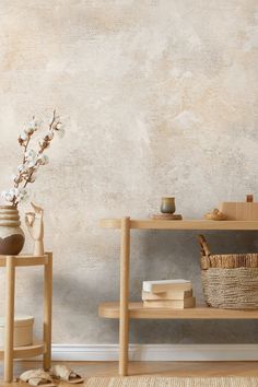 a shelf with some vases and books on it