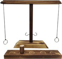 a wooden stand with two metal hooks on each end and a piece of wood in the middle