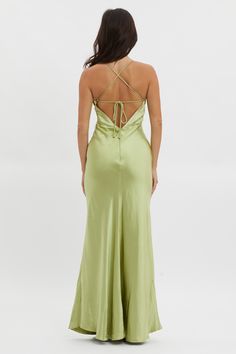 the back of a woman wearing a green dress