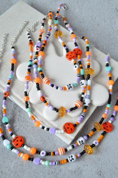 Halloween Pumpkin Beaded Necklace Spooky Bead Necklace Custom Beaded Necklace Skull Necklace - Etsy Bohemian Halloween Jewelry With Round Beads, Halloween Multicolor Beaded Bracelets, Multicolor Beaded Halloween Jewelry, Beaded Jewelry For Halloween Festival, Halloween Jewelry With Round Letter Beads, Halloween Festival Black Beaded Jewelry, Halloween Necklace With Round Beads, Halloween Festival Jewelry With Round Beads, Halloween Festival Jewelry With Black Beads