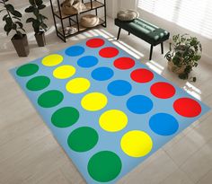 a colorful rug is on the floor in a room with potted plants and a bench