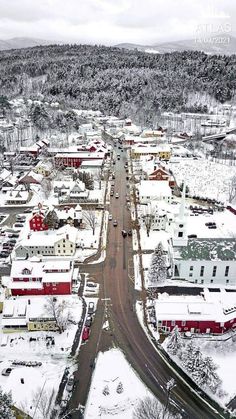 an aerial view of a town in the winter