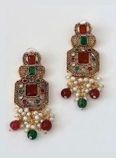 A light weight, south asian inspired multi-color stone earrings which will perfectly elevate any style. Made with exquisite materials, these minimalistic pearl earrings are a perfect blend of sophistication, elegance and durability. Due to the one-of-a-kind nature of the medium, exact colors and patterns may vary slightly from the image shown. Measurements (L x W): 3 inches x 1 inches Estimated Delivery: 3-4 Days. Acrylic Clutch, Embroidered Clutch, Colors And Patterns, The Medium, Boho Bags, Asian Inspired, Color Stone, Black Earrings, South Asian