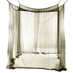 a bed with sheer curtains hanging from it's sides and the bottom half open