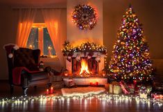 a living room decorated for christmas with lights on the fireplace and presents under the tree