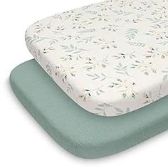 two mattresses sitting side by side on top of each other in front of a white background