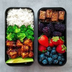 two lunch boxes filled with rice, fruit and meat next to each other on a gray surface