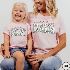 ALL INFANT, TODDLER AND YOUTH SIZES ARE PRINTED WITH MERRY MINI.  ALL ADULT UNISEX TEES ARE PRINTED WITH MERRY MAMA.   These Merry Mama and Merry Mini shirts are the perfect tees to wear as a matching family set all season long!  The cute Christmas tree graphics, combined with a classic varsity font, are sure to remain a staple in your closet for years to come.  Buy for yourself and your "mini" or makes these t-shirts a gift for your favorite Mama and her Mini. PLEASE READ THROUGH ALL OF THE FOL Family Matching Letter Print Holiday Tops, Family Matching Holiday Tops With Letter Print, Matching Cotton Tops For Christmas, Matching Cotton Christmas Tops, Matching Christmas Cotton Tops, Letter Print Tops For Family Holiday, Holiday Letter Print Tops For Family, Holiday Family Letter Print Tops, Holiday Tops With Letter Print