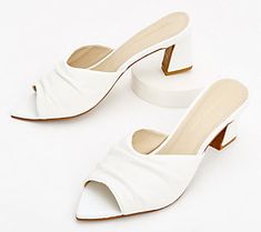 Take a smart step forward in these sophisticated mules. A pointed toe is a classic touch, making them ideal when paired with skirts, capris, or shorts. From Intentionally Blank. Block Heel Sandals For Office Spring Wear, Spring Office Sandals With Block Heel, Spring Office Kitten Heels With Block Heel, Summer Office Mules With 4-inch Heel, White Low Heel Sandals For Office, Spring Office Sandals, Medium Width, Summer Office Heels With Block Heel, Chic Almond Toe Mules With Wrapped Heel, Spring Office Mules With Stacked Heel