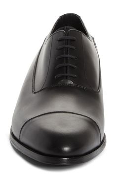 Crafted in France from silky calfskin, this cap-toe derby boasts a renowned Blake construction and a monogram-debossed sole. Lace-up style Removable, cushioned insole Leather upper and lining/leather and rubber sole Made in France Designer Shoes Classic Black Cap Toe Derby Shoes, Classic Black Cap Toe Derby, Luxury Cap Toe Oxfords For Derby, Luxury Fitted Derby With Leather Sole, Luxury Fitted Cap Toe Derby, Luxury Derby With Cap Toe And Rubber Heel Cap, Luxury Cap Toe Derby With Rubber Heel Cap, Luxury Cap Toe Derby With Rubber Sole, Luxury Cap Toe Derby For Workwear