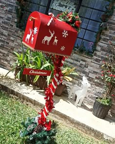 a mailbox decorated with red and white christmas decorations