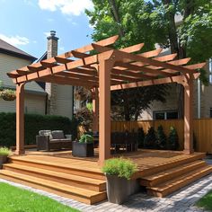 a patio with wooden steps and an attached pergolan